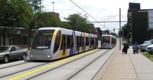 A rendering of the new LRT vehicles traveling through the city on dedicated rights-of-way